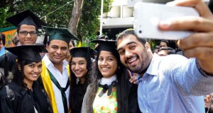IT Minister K. Taraka Rama Rao attends a selfie session with students at the Muffakham Jah College of Engineering and Technology graduation day  in Hyderabad. Photo: The Hindu